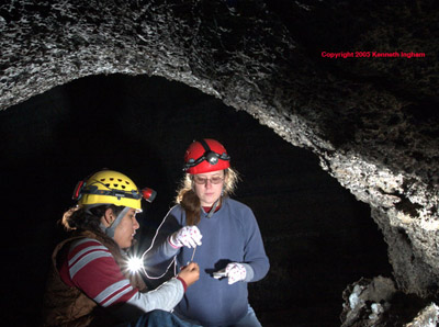 Monica and Kylea inoculate petri dishes with bacteria in Four Windows Cave.
