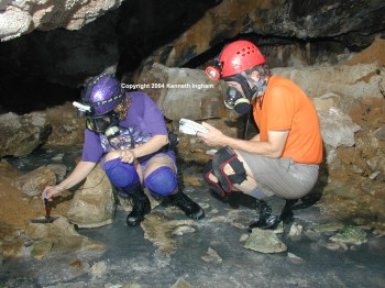 Mike Spilde and Diana Northup take oxidation-reduction potential readings in highly reducing black mud in a tiny pool called the Teapot pool in Cueva de Villa Luz, Tabasco, Mexico.