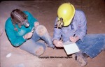 Ziggy and Diana measuring a cricket they trapped in a cave.